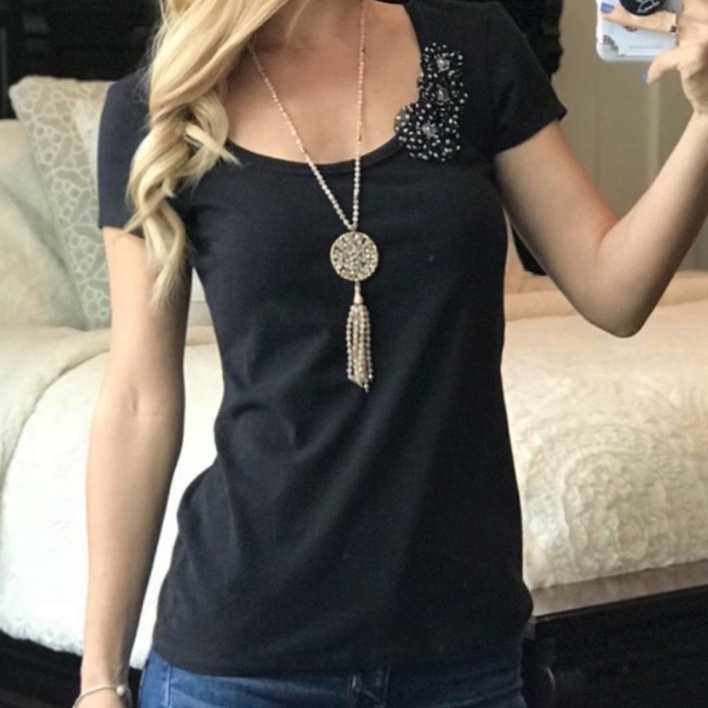 WHBM black top with three accent flowers